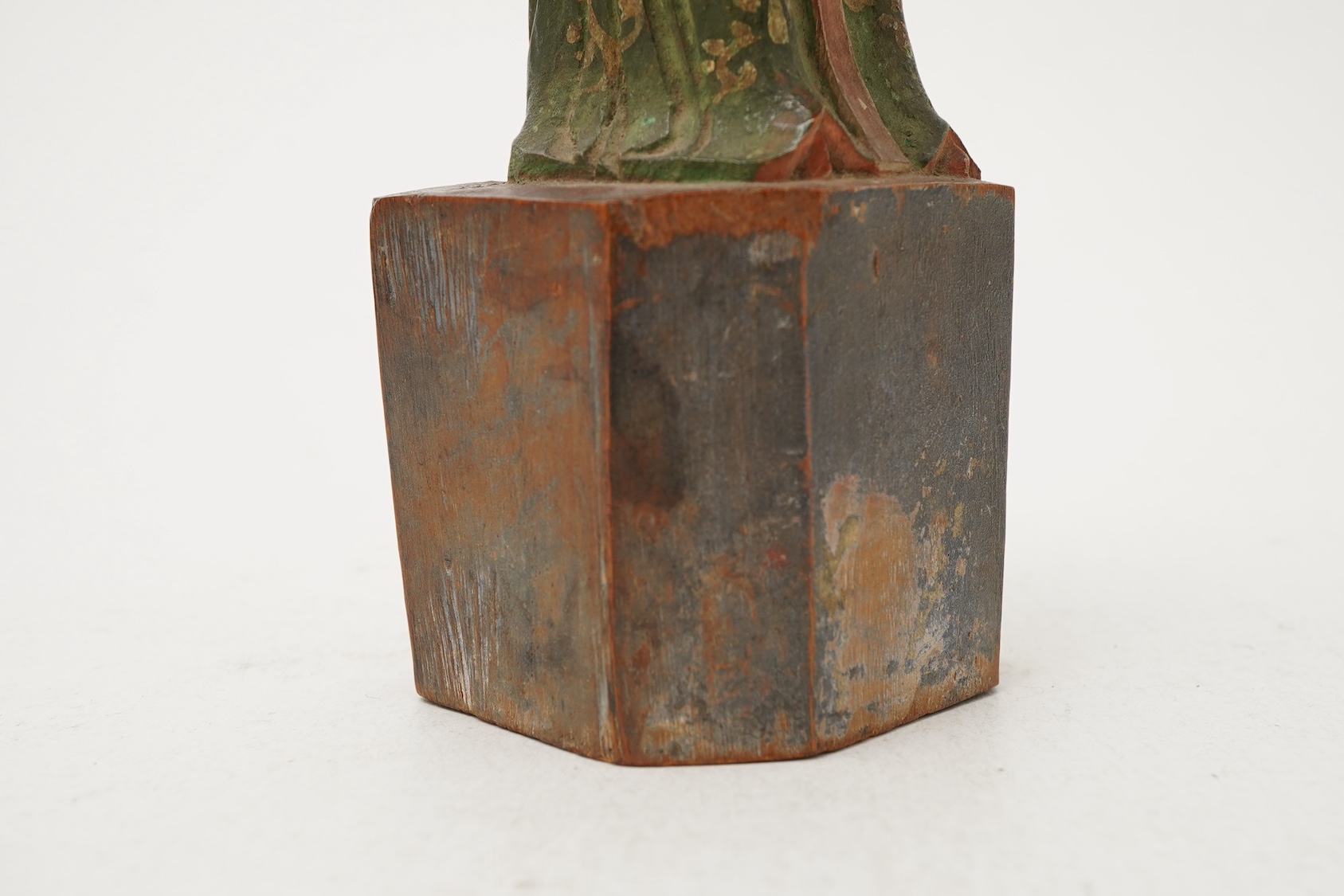 A Chinese polychrome wood figure of a female attendant, Qing dynasty